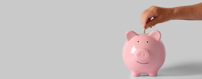 Hand-putting-quarter-into-piggybank-MVBA-conducts-annual-taxable-value -audits-school-district-clients-Texas-thumbnail2